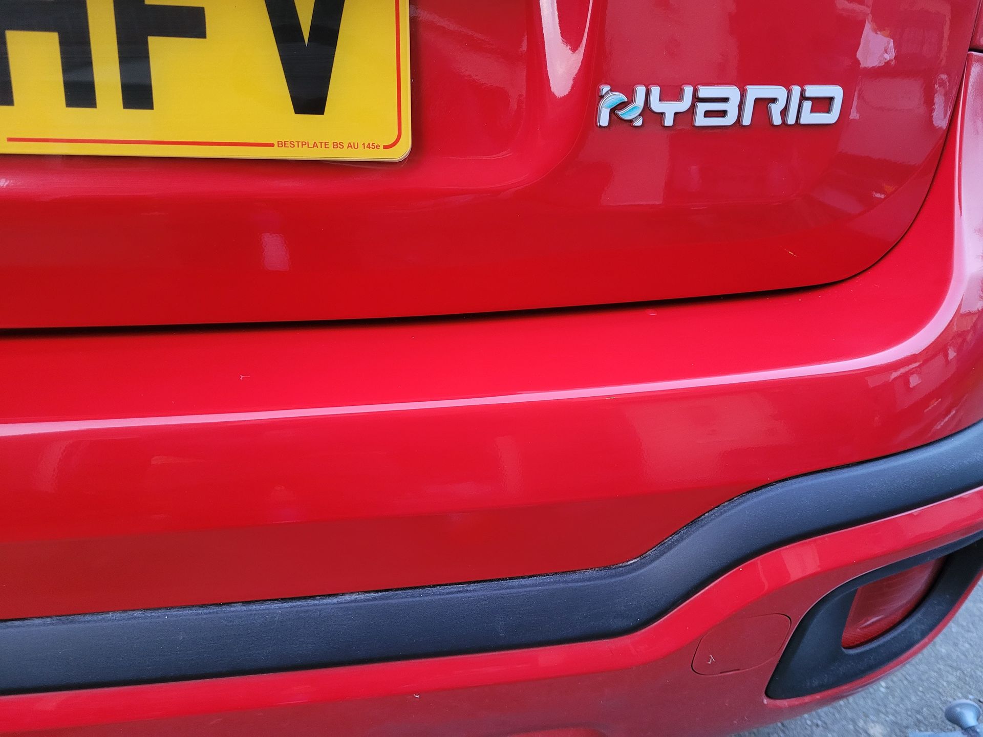 Red car dent after repair