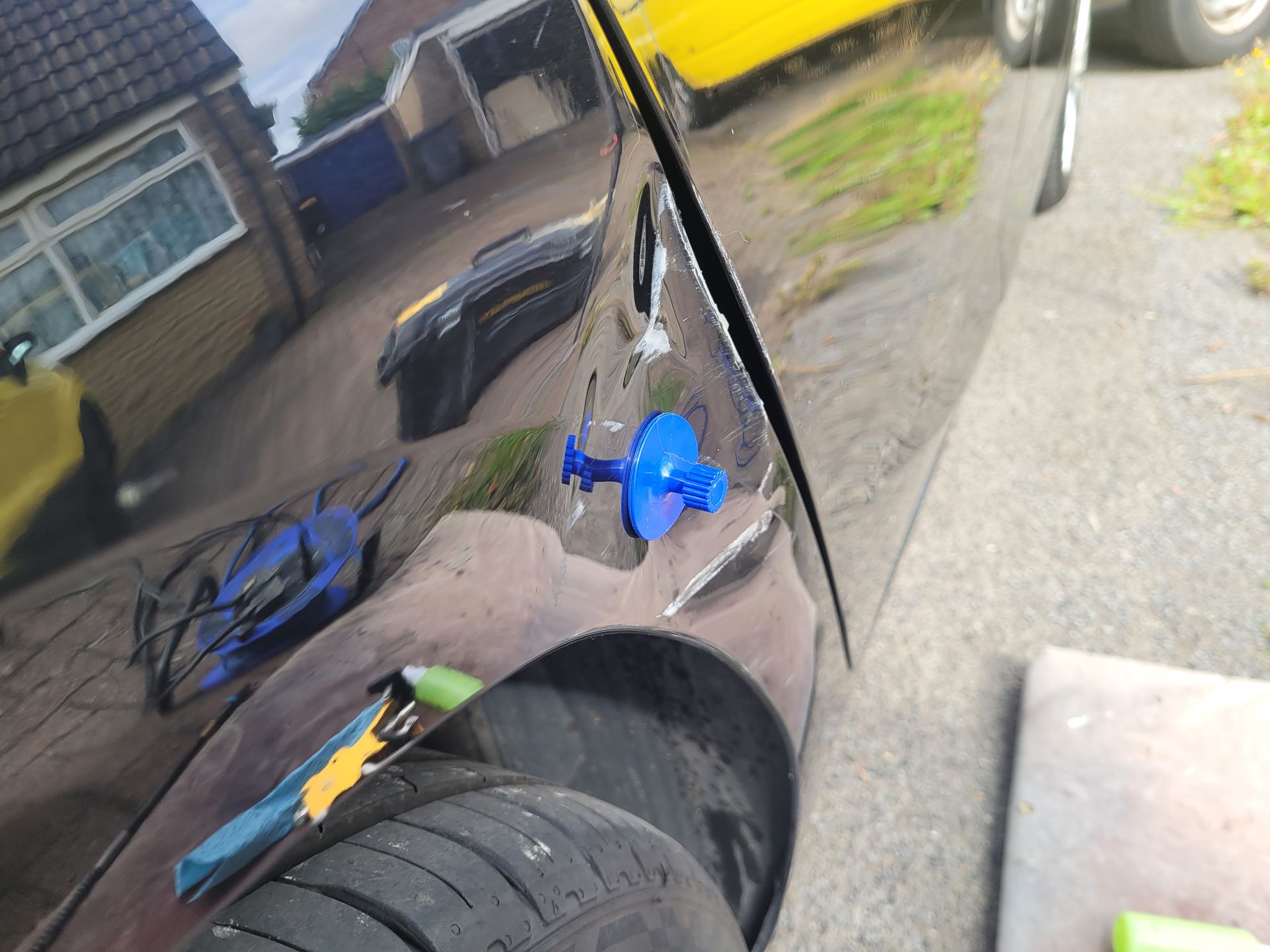 Black car dent before repair