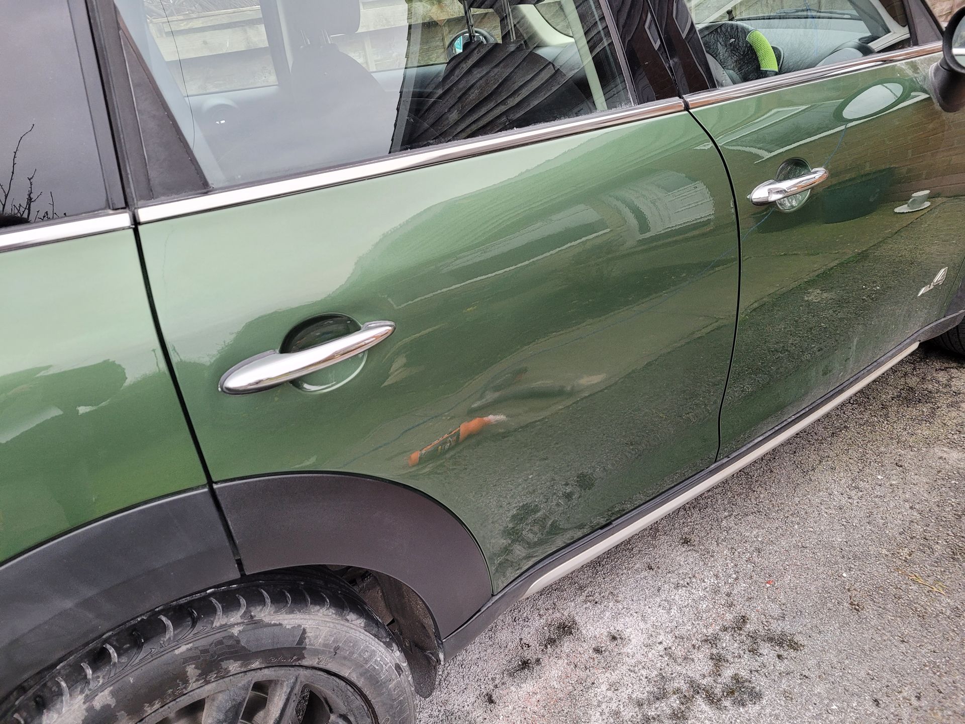 Green car dent after repair