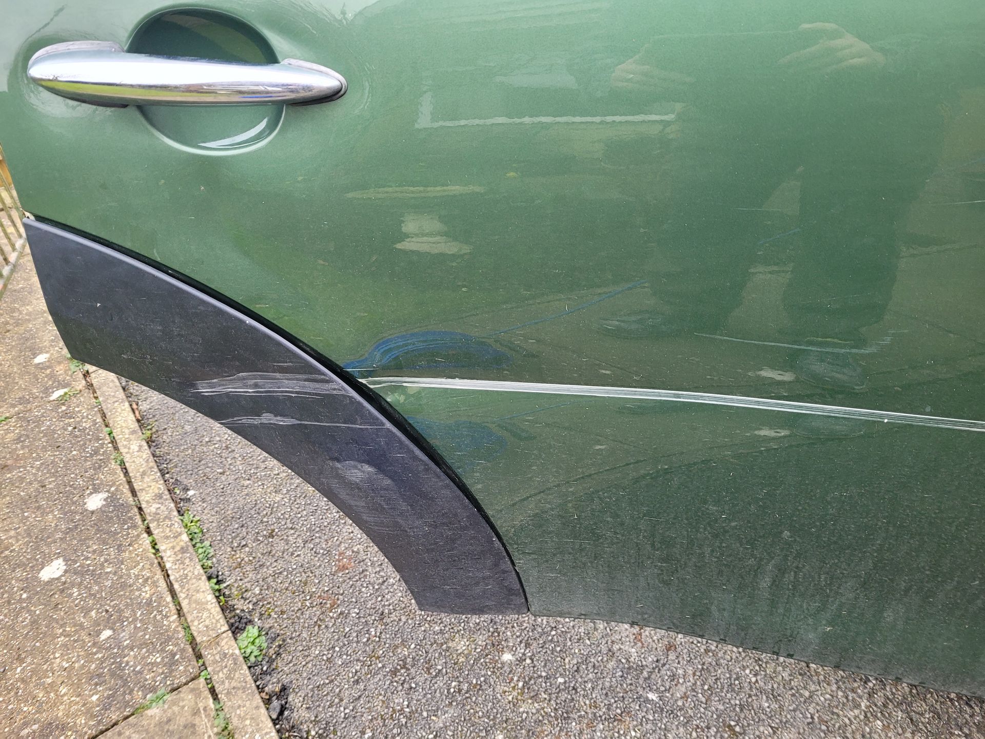 Green car dent before repair